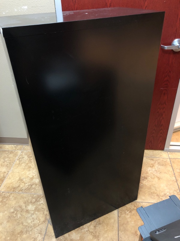 Photo 2 of Black metal 4 drawer vertical office cabinet.