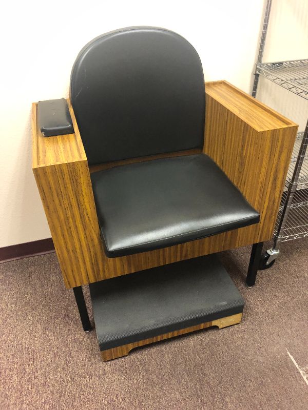 Photo 1 of Black leather chair with foot platform underneath