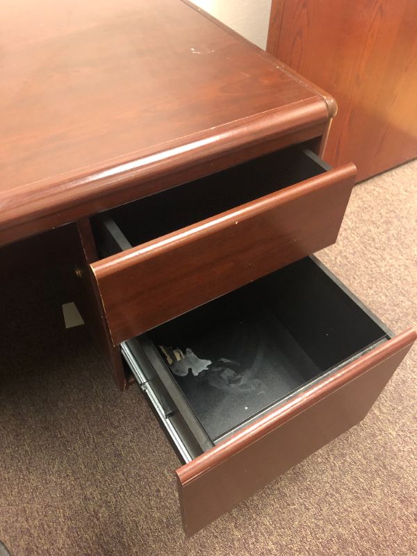 Photo 5 of Oversized office desk with black chair.