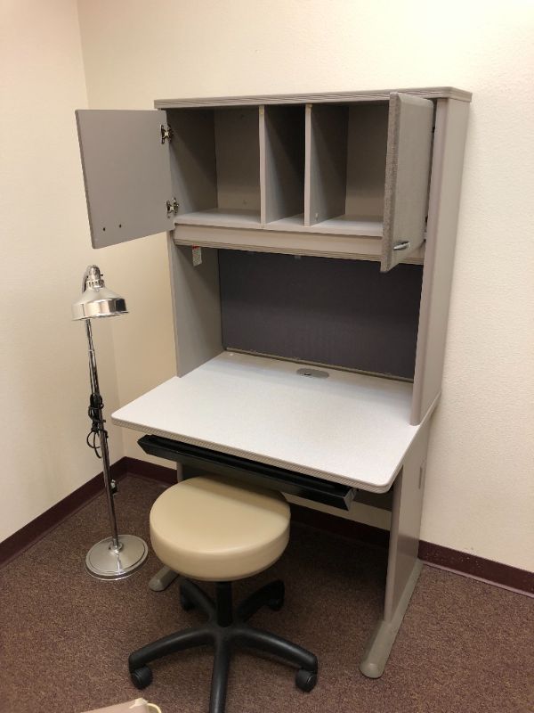 Photo 1 of 2 tier, 2 cabinet work desk with cream leather chair and lamp.