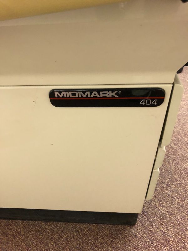 Photo 4 of Midmark 404 medical exam table.