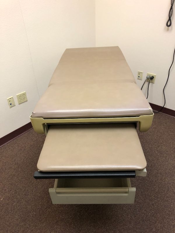 Photo 2 of Midmark 404 medical exam table.