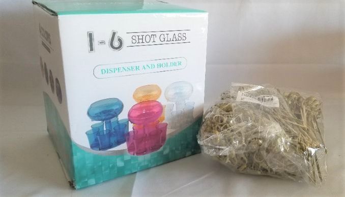 Photo 1 of shot class dispenser and glasses and a bag of drink stirrers