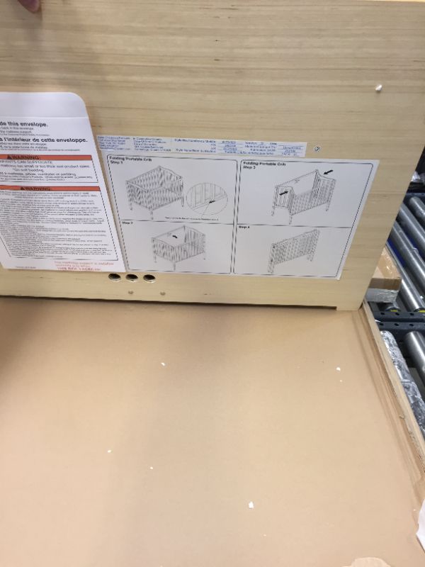 Photo 1 of Delta Children Folding Portable Crib with Mattress Grey