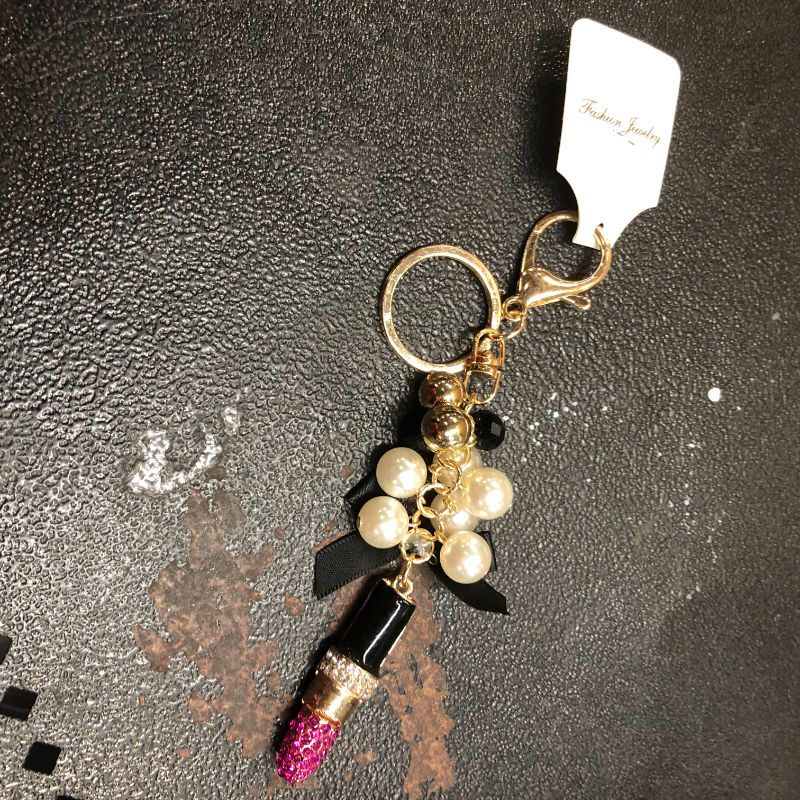Photo 1 of lipstick hand bag chain keychain
