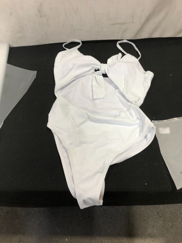 Photo 1 of 1 piece white bathing suit 
l