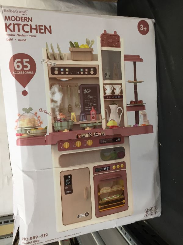 Photo 2 of Deluxe Play Kitchen with Realistic Steam| Electronic Lights | Sizzling Sounds| Classic Music| Tap Water& 65 Pc Kitchen Accessories Set (possibly missing pieces)