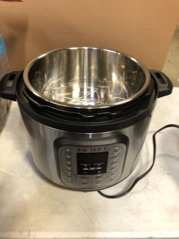 Photo 3 of USED---Instant Pot Duo 7-in-1 Electric Pressure Cooker, Slow Cooker, Rice Cooker, Steamer, Sauté, Yogurt Maker, Warmer & Sterilizer, 8 Quart, Stainless Steel/Black
