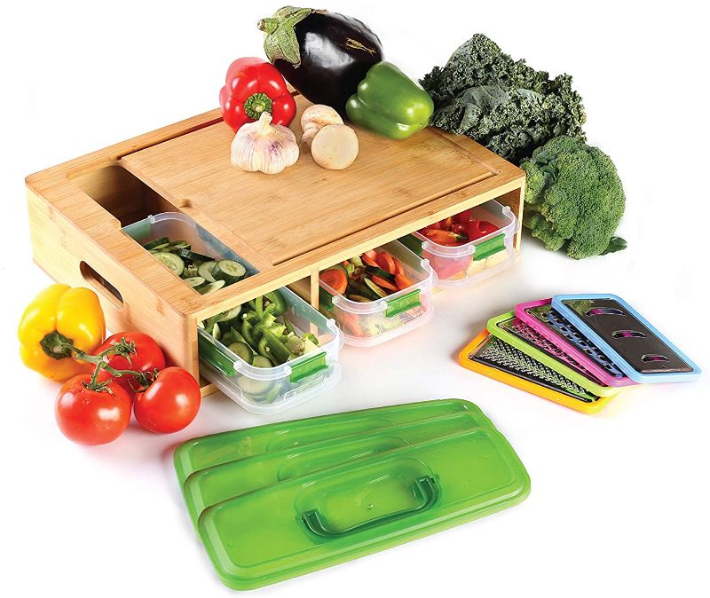 Photo 1 of Bamboo Cutting board with 3 containers each with clip seal lids, food, microwave and dishwasher safe, 3 graters, 1 slicer, eco, organic and environmentally friendly

