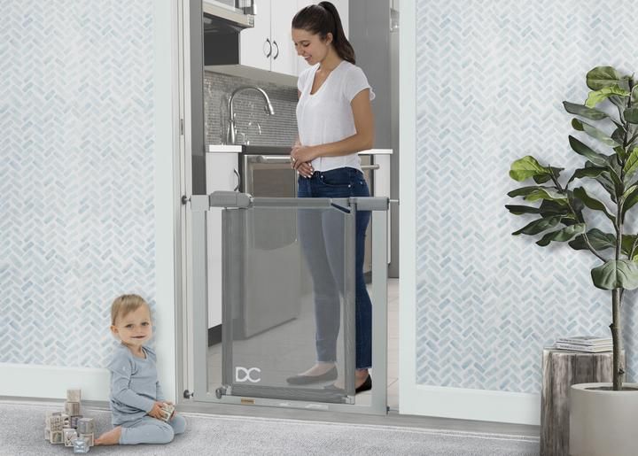 Photo 1 of Adjustable Baby Safety Gate - Easy Fit Pressure Mount Design with Walk-Through Door
