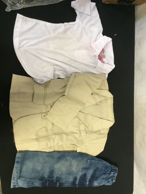 Photo 1 of 3 pack of childrens clothes 2 shirts and one pair of jeans size 4