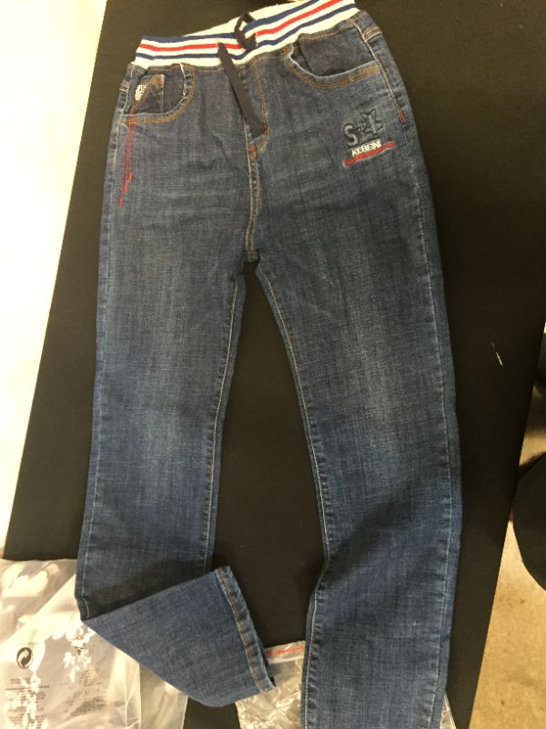 Photo 2 of 2 pair clothing pack one pair of kids jeans size 13 14 and one men's shirt size 4XL