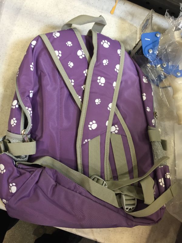 Photo 2 of backpack color purple with dog paw themed 