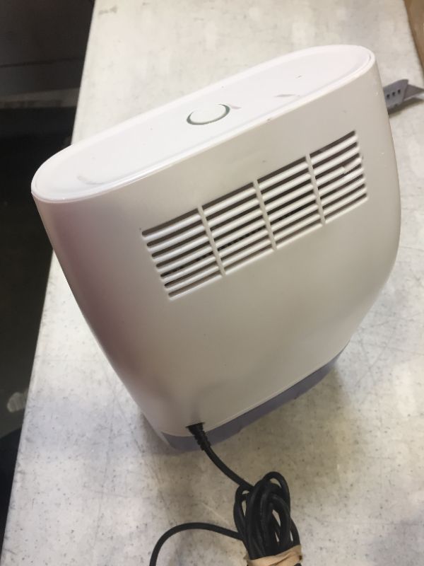 Photo 2 of mini dehumidifier color white  