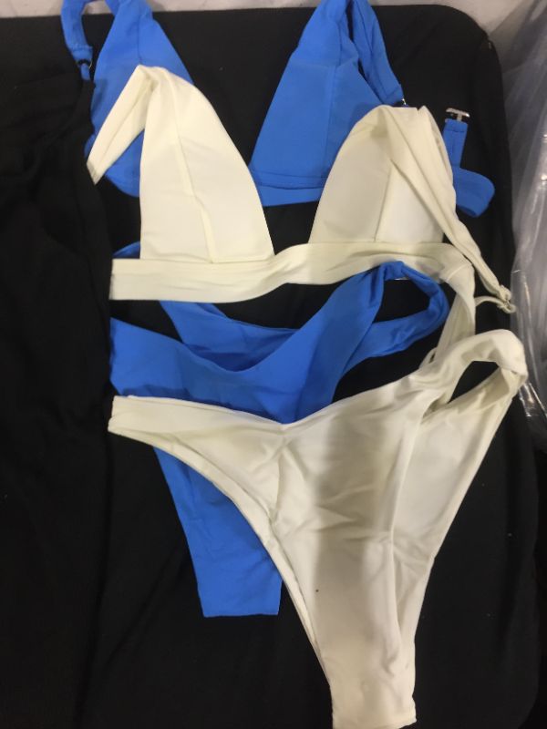 Photo 2 of Assorted Clothing Different Sizes
Blue Bikini: M
White Bikini: S
Joggers: M
Shirt: XL