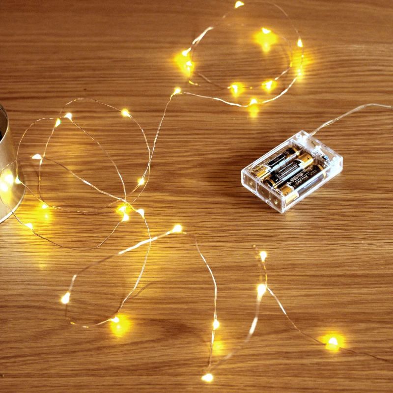 Photo 1 of UNIFUN String Led String Lights,Mini Battery Powered Copper Wire Starry Fairy Lights, Battery Operated Lights for Bedroom, Christmas, Parties, Wedding, Centerpiece, Decoration (5m/16ft Warm White)