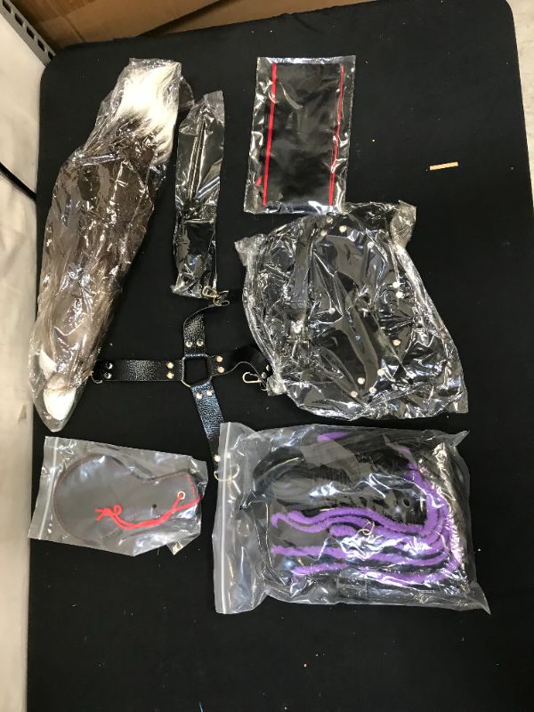 Photo 1 of SEX TOY KIT, COMES WITH ANAL PLUG WITH TAIL, MASK, BALL GAG, HAND AND FEET CUFFS PURPLE, PADDLE AND WHIP, BLIND FOLD AND FEATHER TICKLER