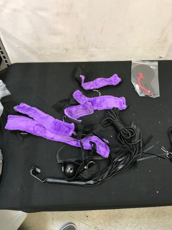 Photo 1 of SEX TOY KIT, COMES WITH ANAL PLUG WITH TAIL, MASK, BALL GAG, HAND AND FEET CUFFS PURPLE, PADDLE AND WHIP, BLIND FOLD AND FEATHER TICKLER