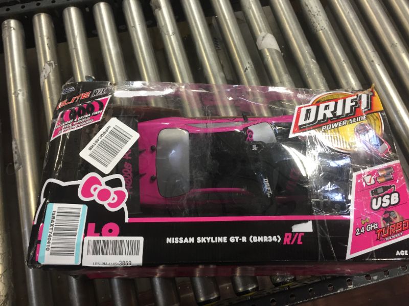 Photo 7 of Jada Toys Hello Kitty Nissan Skyline GT-R (Bnr34) Drift Power Slide Elite R/C, USB Charging, with 4 Extra Tires, Pink
