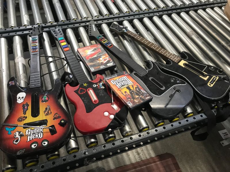 Photo 1 of 4 ASSORTED GUITAR HERO GUITARS AND 3 GAMES