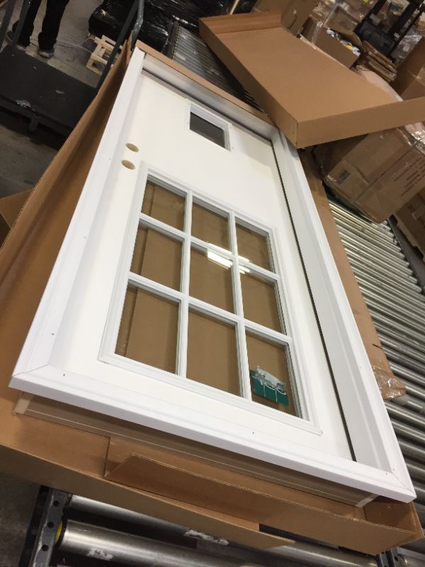 Photo 2 of 36 x 80 in 9 panel window pet door -minor dent in door as shown.