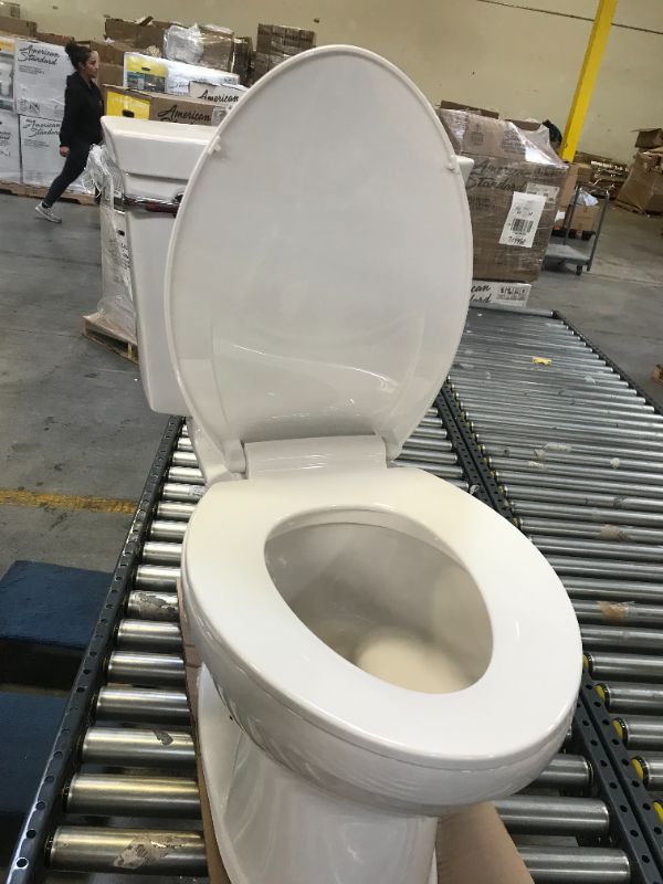 Photo 4 of Champion Tall Height 2-Piece High-Efficiency 1.28 GPF Single Flush Elongated Toilet in White Seat Included