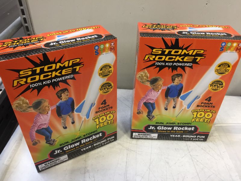 Photo 2 of Stomp Rocket The Original Jr. Glow Rocket Launcher, 4 Foam Rockets and Toy Air Rocket Launcher - Glows in The Dark, STEM Gift for Boys and Girls Ages 3 Years and Up - Great for Year Round Play 2 pack 
