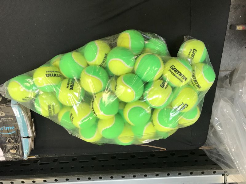 Photo 1 of bundle of tenis balls