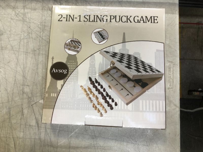 Photo 1 of AVSOG 2 IN 1 SLING PUCK GAME
