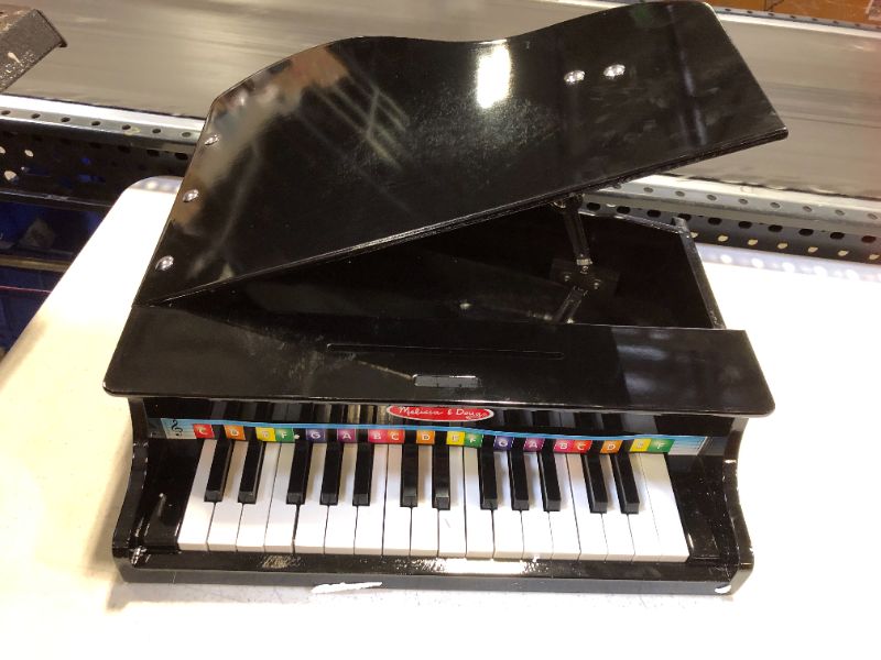 Photo 4 of Melissa  Doug Learn-To-Play Classic Grand Piano With 30 Keys, Color-Coded Songbook, and Non-Tip Bench