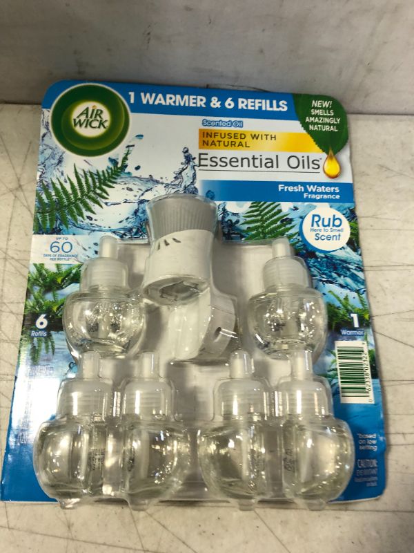 Photo 1 of AIR WICK 1 WARMER 6 REFILLS ESSENTIAL OILS