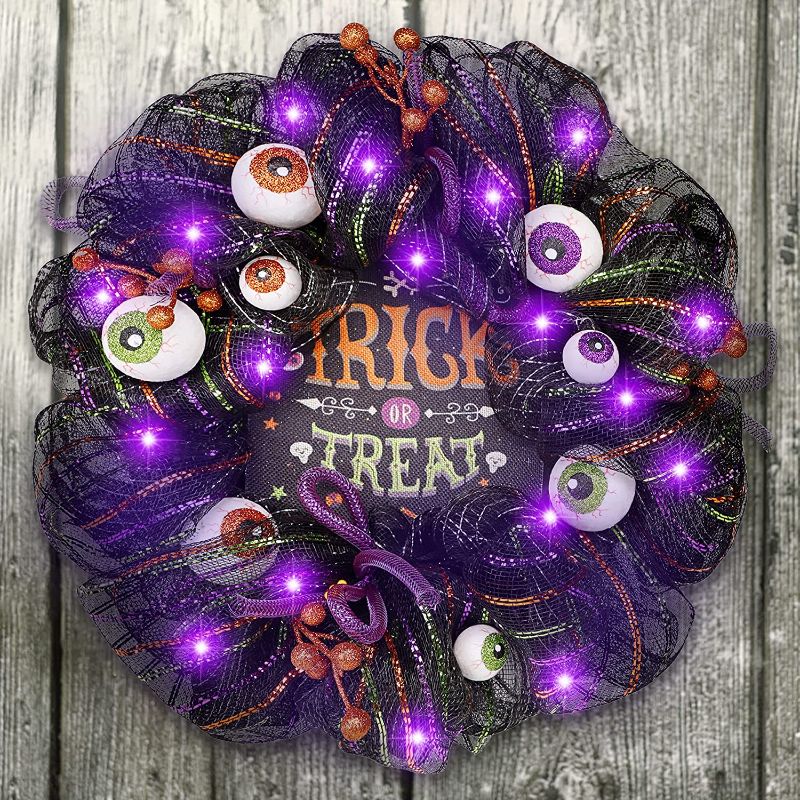 Photo 1 of DR.DUDU 17 Inch Halloween Decorations Wreath with Spooky Skeleton Spider Pumpkin Artificial Flower, Trick or Treat Sign Pre-lit Purple Lights Front Door Ribbon Wreath 