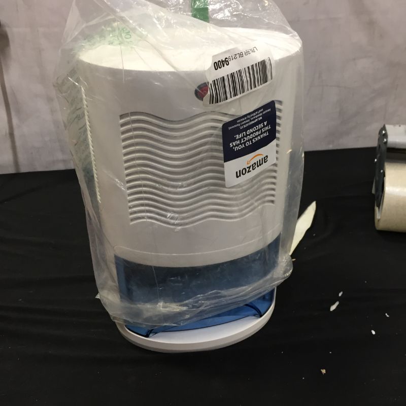 Photo 2 of Pure Enrichment® PureDry™ Mini Dehumidifier - Compact Water Tank Eliminates 300ml/day in Excess Moisture from Closets, Bathrooms, Boats, Kitchens and Other Small Rooms and Living Spaces

