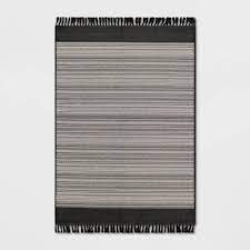 Photo 1 of 7' x 10' Outdoor Rug Striped Fringe Black - Project 62