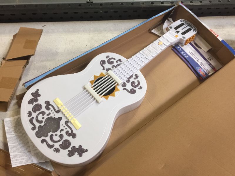 Photo 1 of Disney/Pixar Coco Guitar, Playable Musical Toy with Chord Chart, Approx 25-in (63.5-cm) Long for Kids Ages 3 Years Old & Up [Amazon Exclusive]
