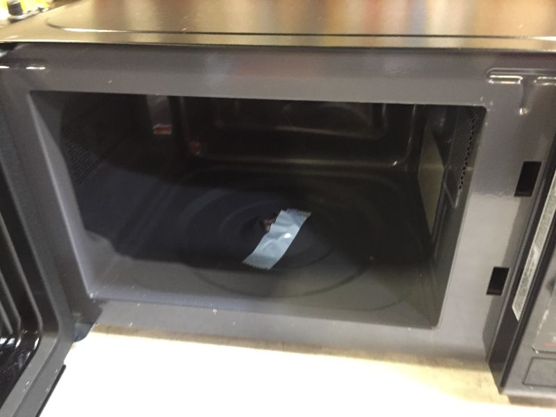 Photo 3 of MAGIC CHEF 0.7 cu. ft. Countertop Microwave in Black with Gray Cavity
