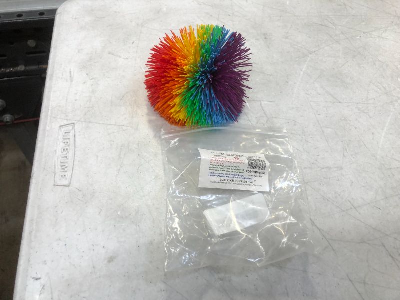 Photo 2 of 4.5Inch Large Rainbow Stringy Ball Silicone Bouncing Fluffy Jugging Ball,Monkey Stress Ball (1 Piece Large, Rainbow)
