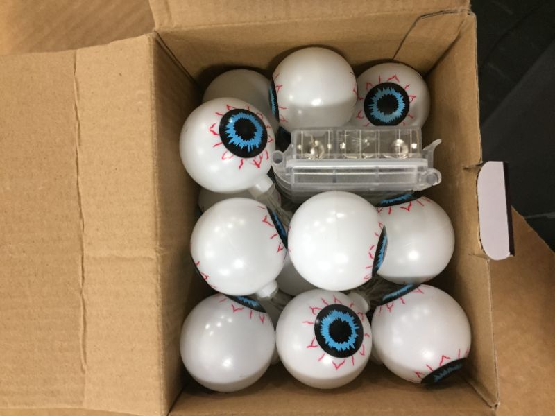 Photo 2 of 9.8FT 30LED Halloween String Lights, Eyeball Lights with Flashing/Steady on Mode, Halloween Decorations Lights Battery Operated for Indoor Outdoor Party Garden Yard Halloween Decor (Warm White)
