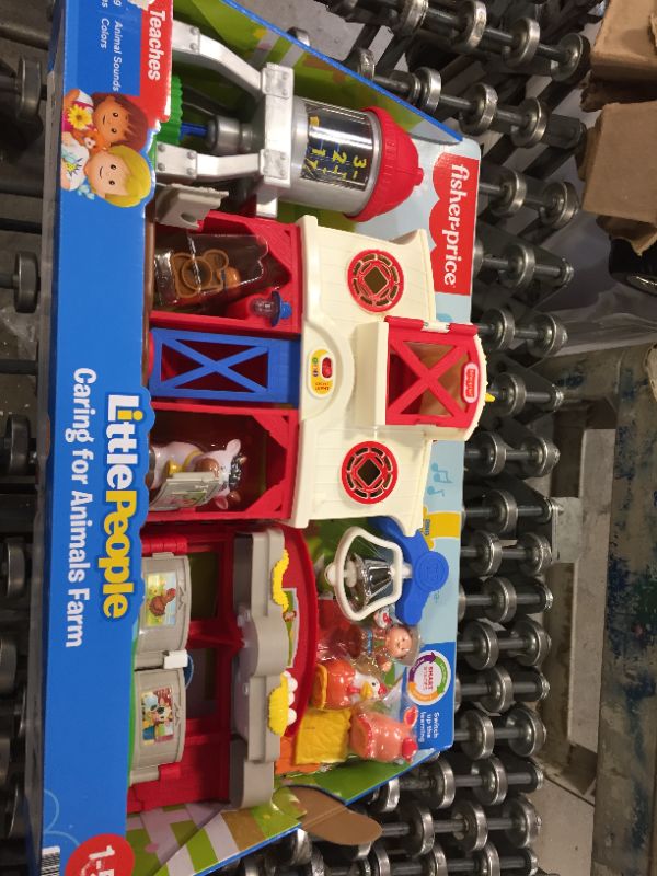 Photo 2 of Fisher-Price Little People Caring for Animals Farm Playset with Smart Stages
