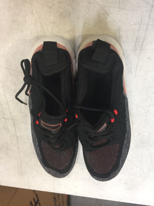 Photo 1 of Black and Orange sports shoes size 10.5