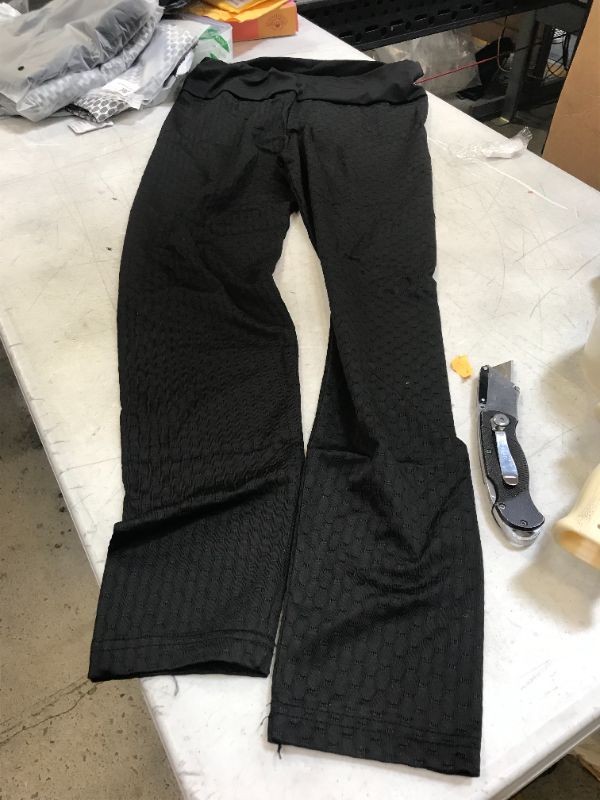Photo 2 of 4 pairs of patterned yoga pants --size medium