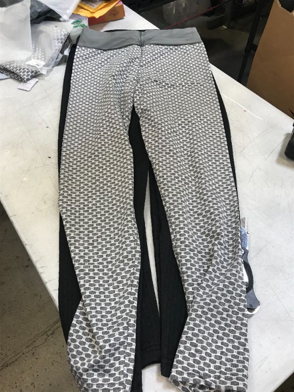 Photo 1 of 4 pairs of patterned yoga pants --size medium