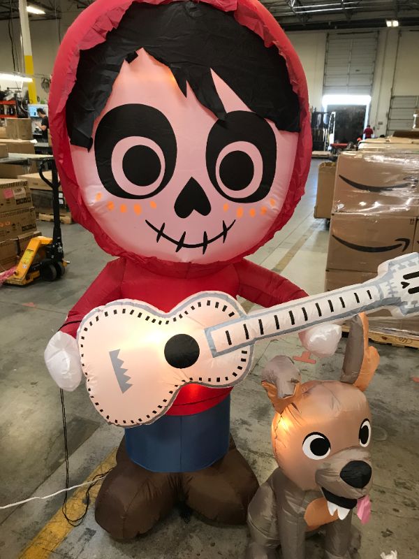 Photo 2 of 6.5 ft. Coco Miguel with Guitar and Dante Scene Airblown Disney Halloween Inflatable
