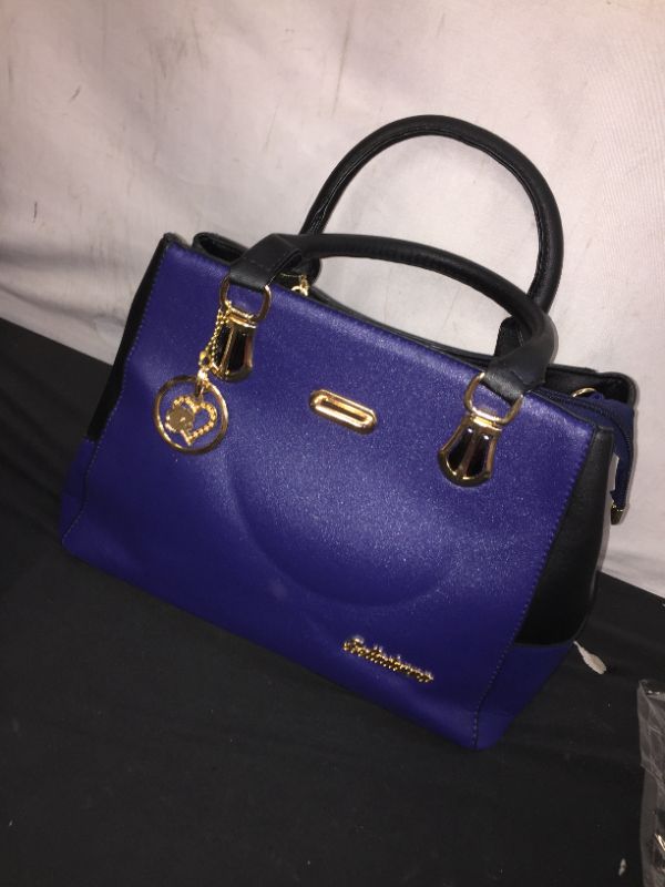 Photo 1 of blue purse