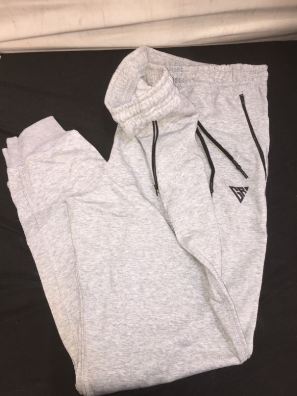 Photo 1 of grey sweatpants with zipper pockets size XXL possibly fits like large or xl 
