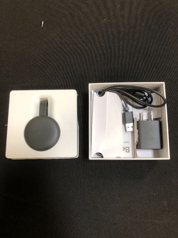 Photo 2 of Google Chromecast - Streaming Device with HDMI Cable - Stream Shows, Music, Photos, and Sports from Your Phone to Your TV
