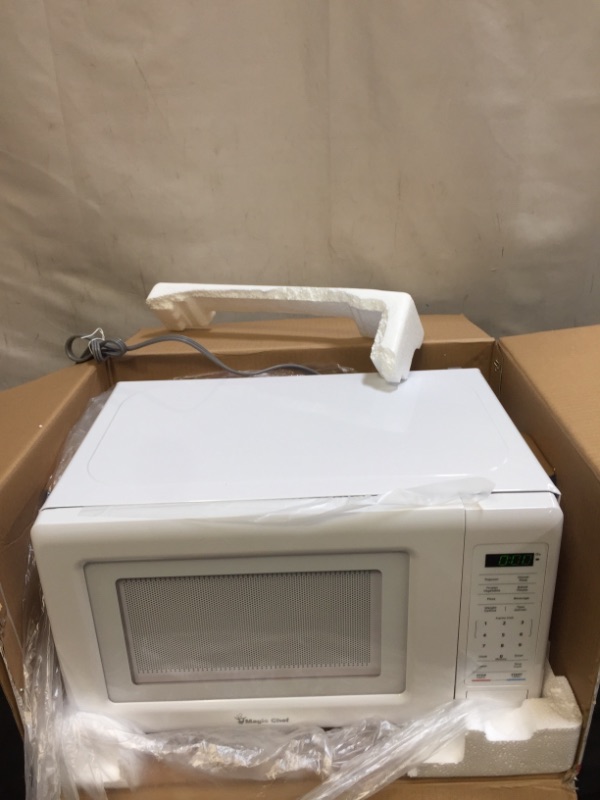 Photo 1 of 0.7 cu. ft. countertop microwave in white | magic chef kitchen timer convenience
