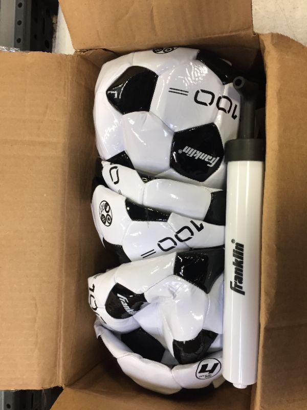 Photo 1 of box of inflatable soccer balls