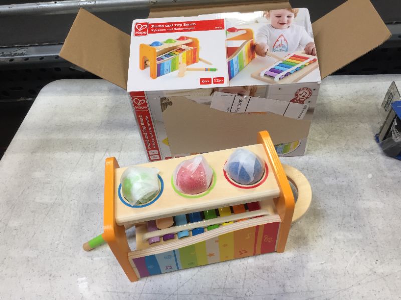 Photo 2 of Hape Pound & Tap Bench with Slide Out Xylophone - Award Winning Durable Wooden Musical Pounding Toy for Toddlers, Multifunctional and Bright Colours, Yellow
