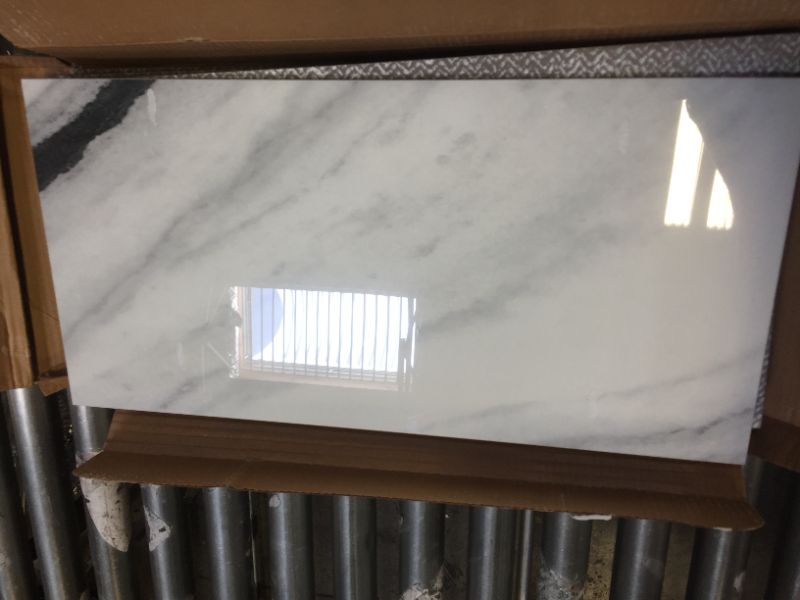 Photo 2 of 11 CASES, VARYING CONDITIONS, ROUGHLY 70% OF TOTAL TILE INTACT, Panda Marble Polished 12 in. x 24 in. Glazed Porcelain Floor and Wall Tile (17.10 sq. ft./case)
